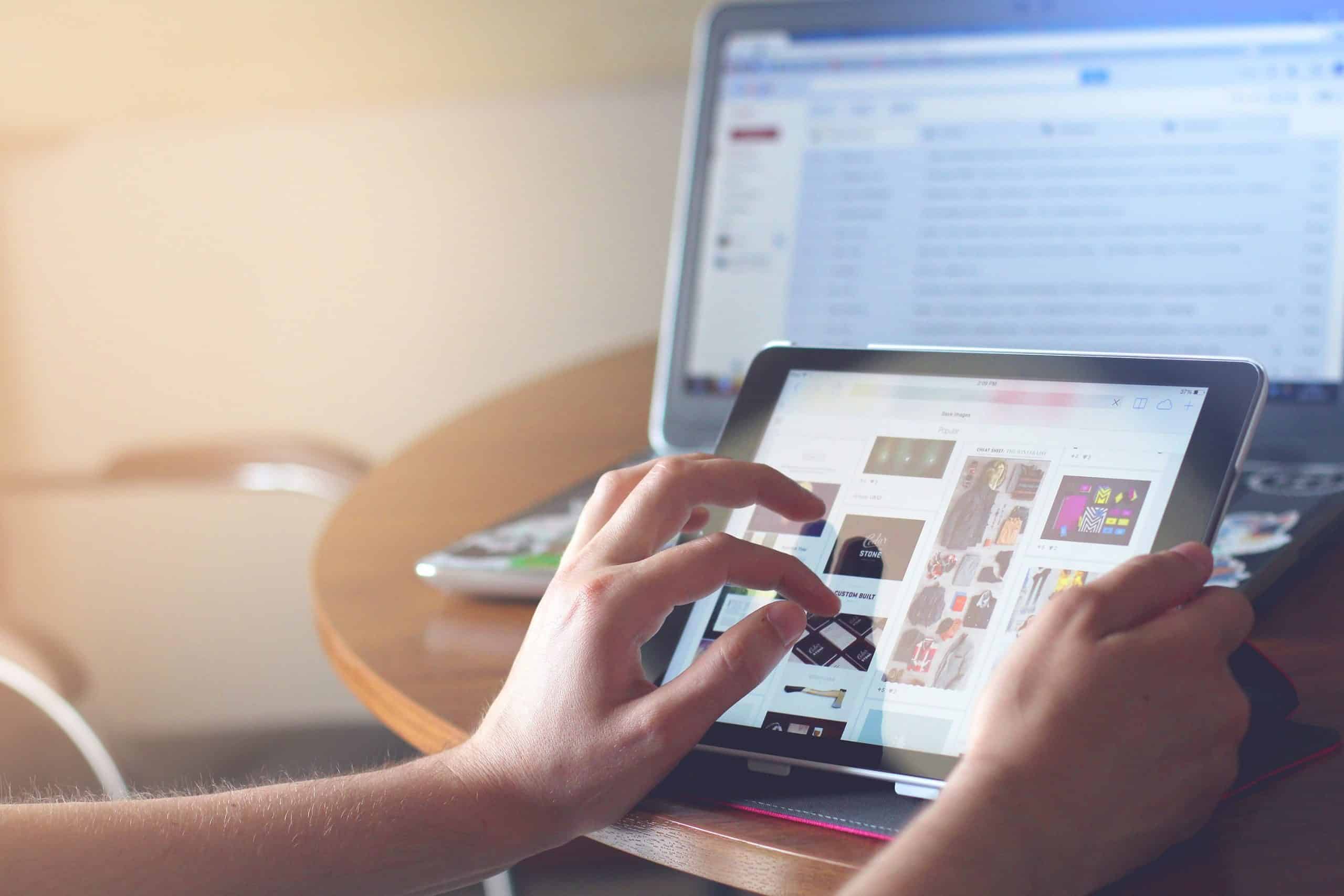 A person surfing the net with a tablet.