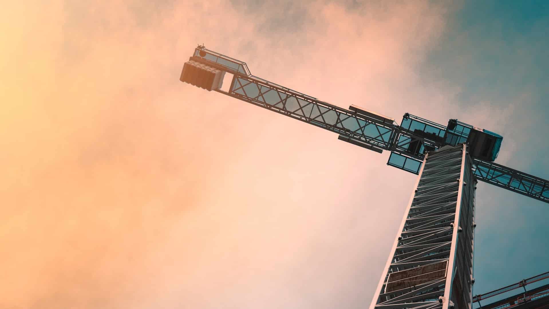 A construction crane at sunset.