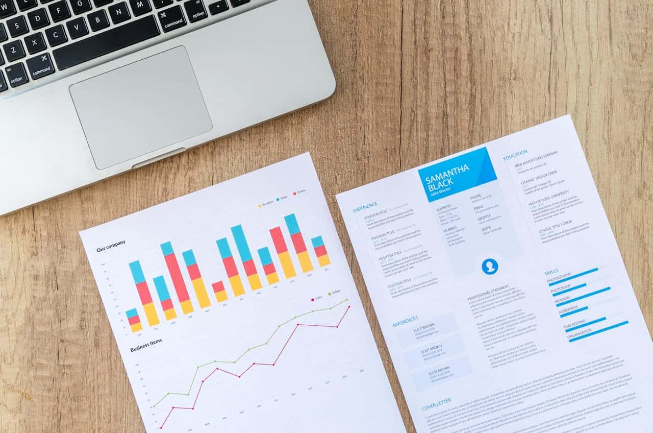 How Localization in Web Design Affects Global Marketing Two sheets of printer paper near a laptop