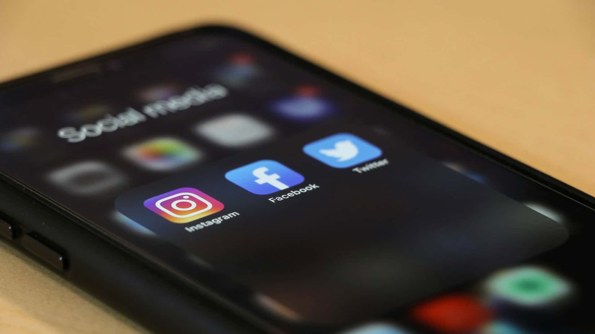 How CRM Data Can Improve Your Social Media Tone (1) A smartphone screen showing three main social media applications.