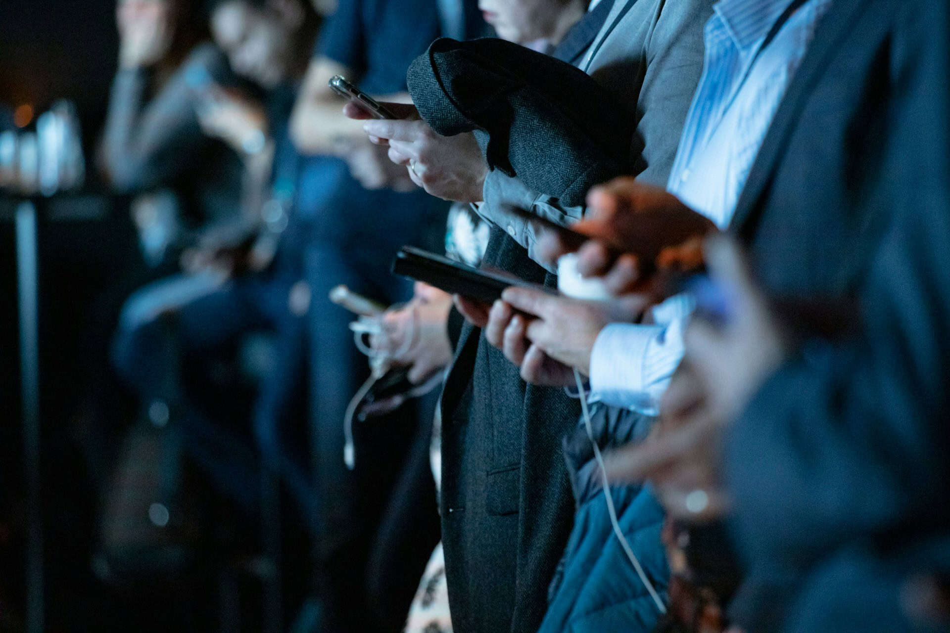 How CRM Data Can Improve Your Social Media Tone (2) A group of people browsing their phones.