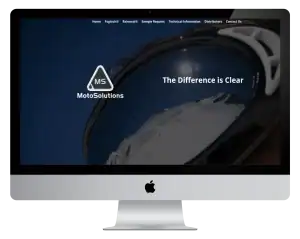 An iMac screen displays a MotoSolutions webpage showing snowy mountains reflected in ski goggles, with the text The Difference is Clear and the MotoSolutions logo.