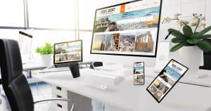 • small business owner reviewing website design on laptop